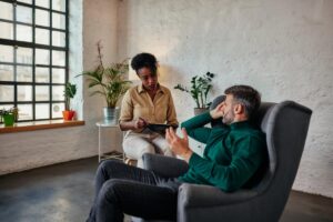 A man in an addiction therapy session.