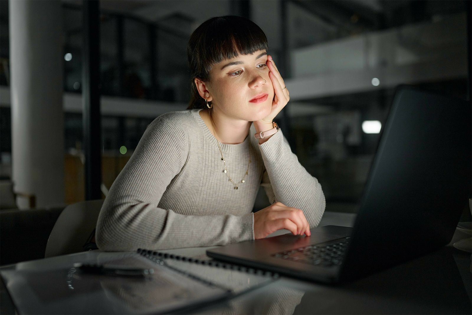 Seeking validation | woman staring into social media on her laptop