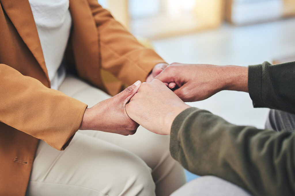 Person holds hands with loved one as they discuss adhd vs add