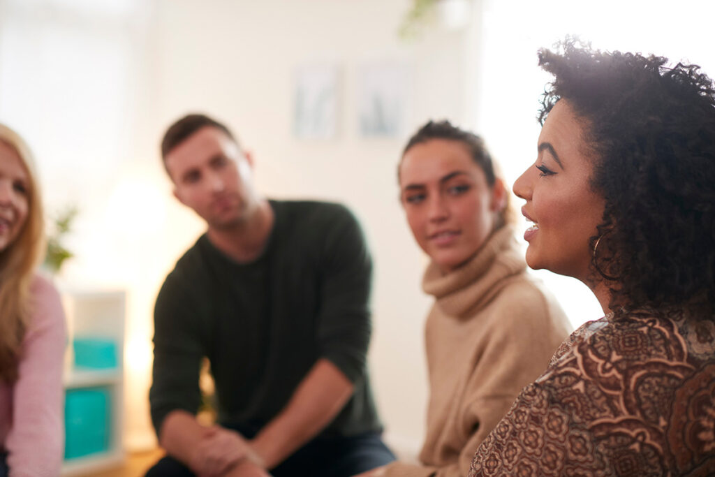 Group of people talk about addiction's affect on their relationships