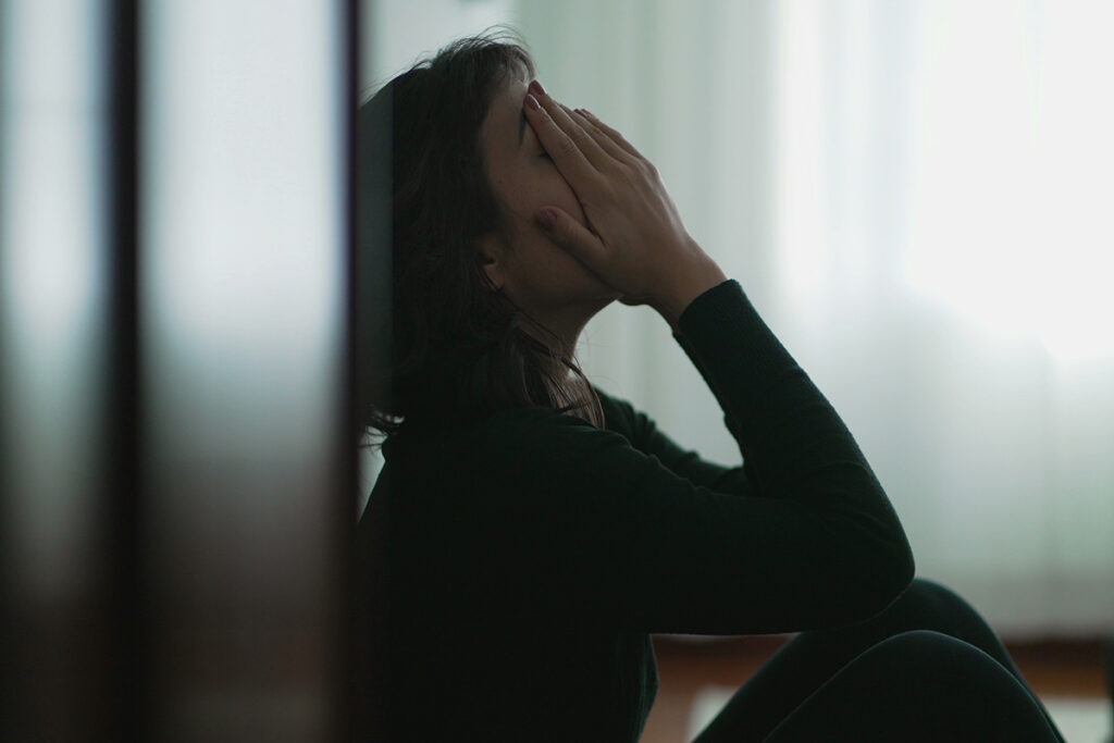 Person thinking about alcohol and depression