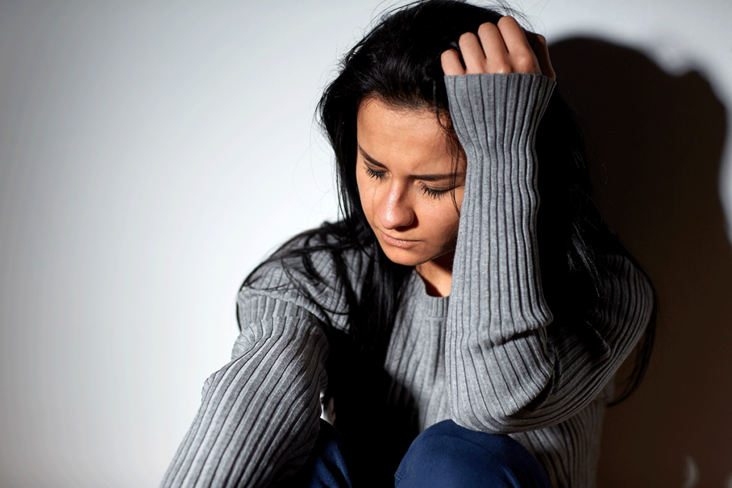 a woman sitting on the floor