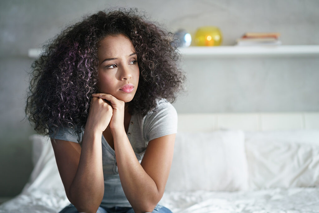 Person thinking about common mental health conditions