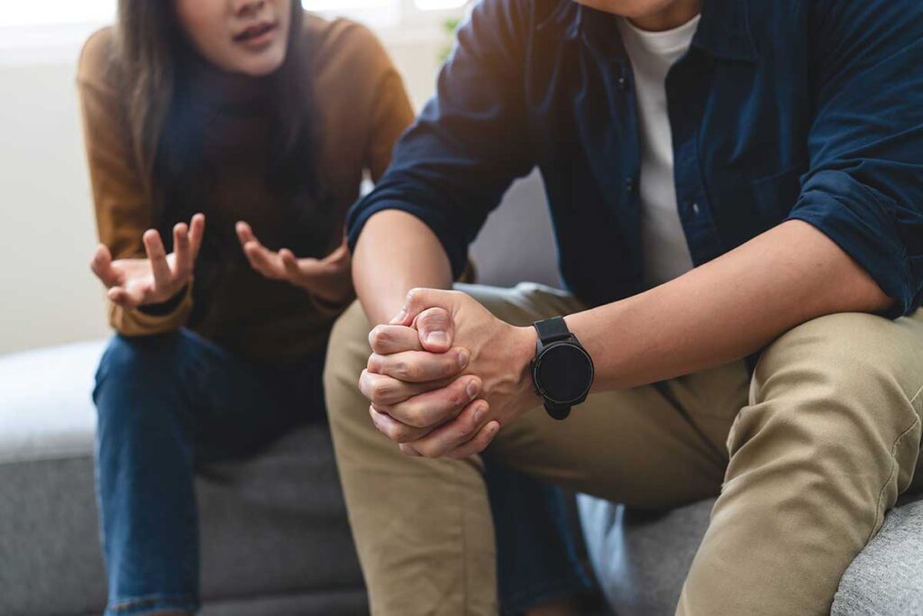 Hands of two people talking about what an enabler is