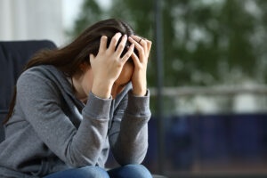 a woman holding her head