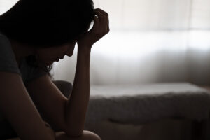Person thinking about how to help someone with depression